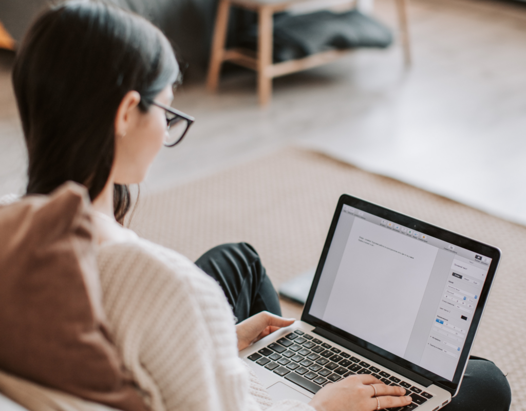 Woman typing on a laptop