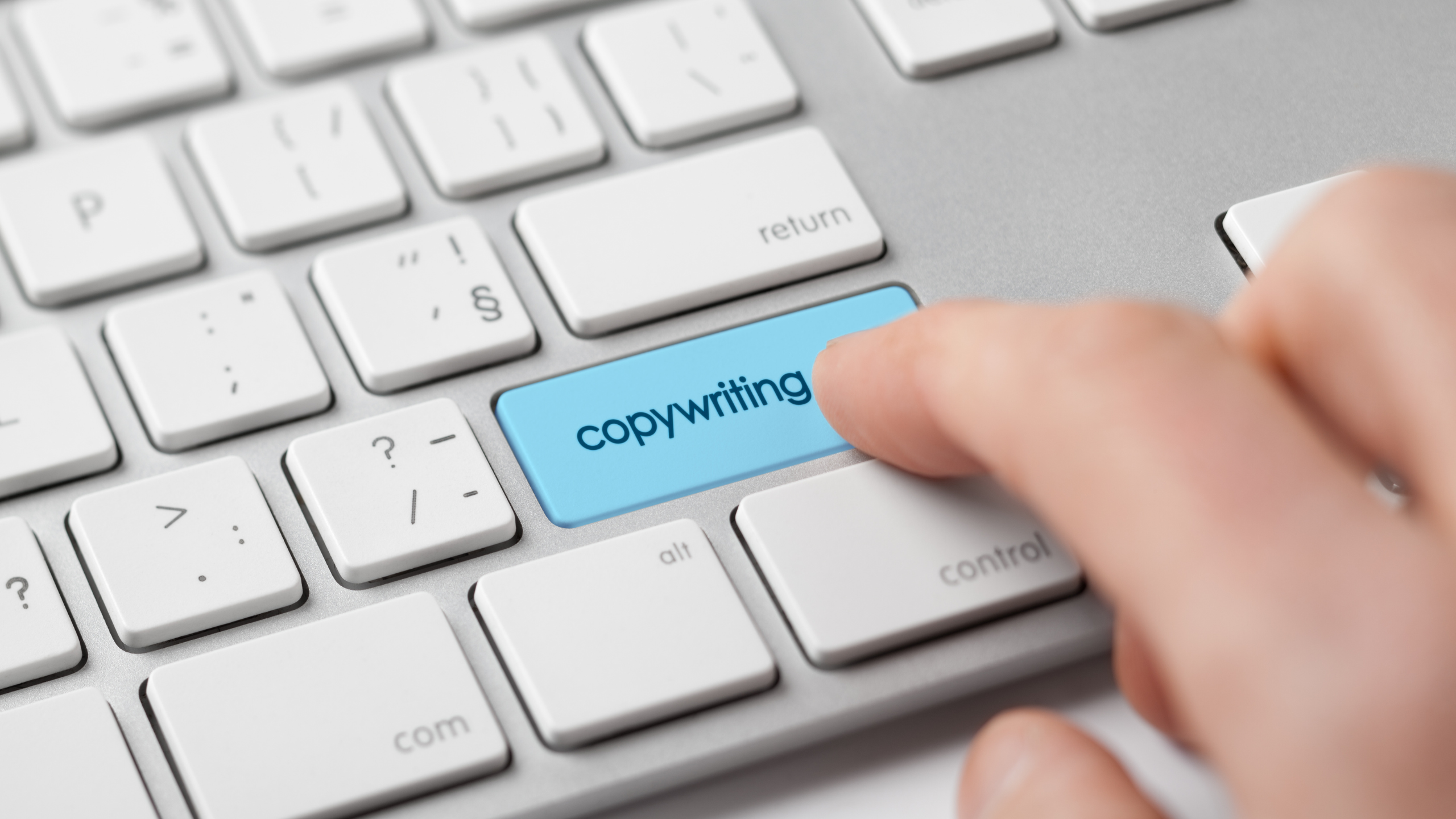 Finger Pressing Enter Key labeled "Copywriting"